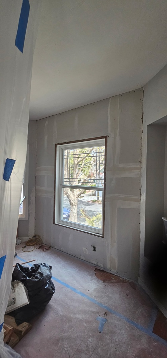Room drywall installation with window
